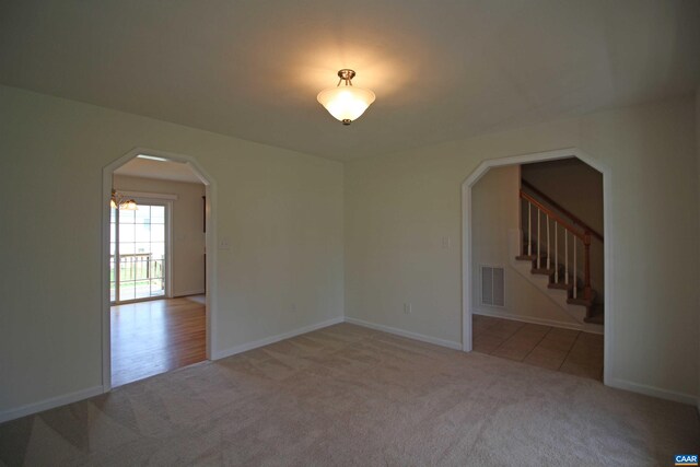 10 Lady Slipper Dr, Waynesboro, VA 22980 - carpeted spare room featuring arched walkways, stairs, and baseboards