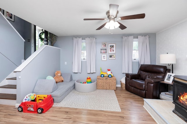 146 Harper St, Weyers Cave, VA 24486 - living room featuring healthy amount of natural light, wood finished floors, stairway, and a ceiling fan