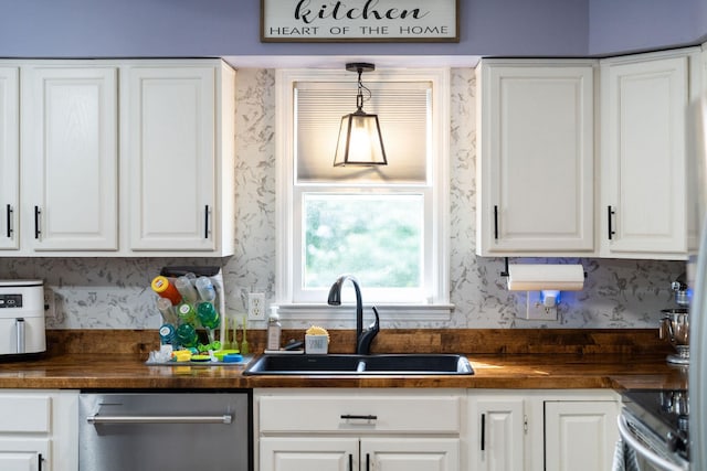 146 Harper St, Weyers Cave, VA 24486 - kitchen with wallpapered walls, appliances with stainless steel finishes, a sink, butcher block countertops, and white cabinets