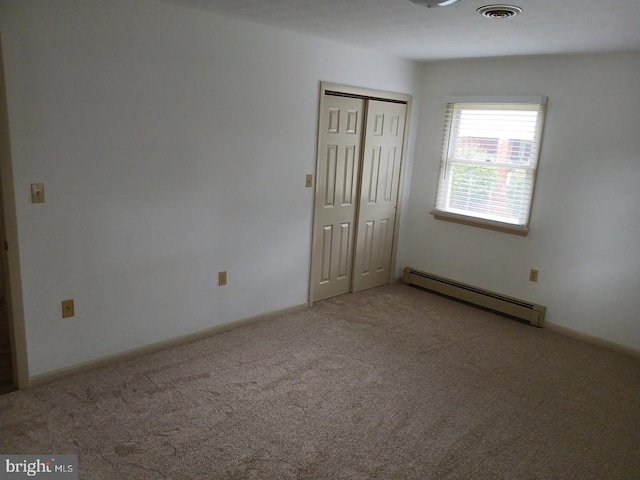 16 Park Ave, Luray, VA 22835 - unfurnished bedroom with a baseboard radiator, carpet, and a closet