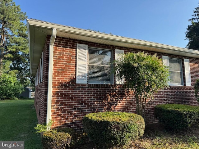 16 Park Ave, Luray, VA 22835 - view of side of home with brick siding and a lawn