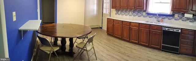 16 Park Ave, Luray, VA 22835 - kitchen with dishwasher, light wood-type flooring, light countertops, backsplash, and a baseboard heating unit