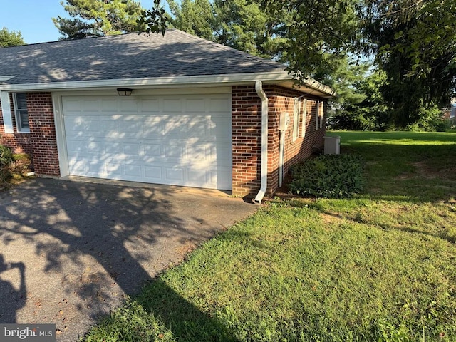 16 Park Ave, Luray, VA 22835 - view of home's exterior with brick siding, a garage, a lawn, and roof with shingles