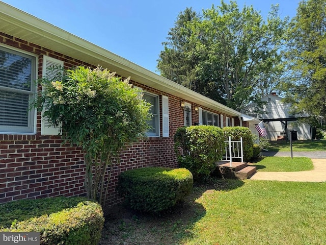 16 Park Ave, Luray, VA 22835 - view of side of home featuring brick siding and a lawn