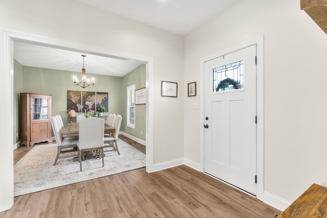 141 Tomasville Dr, Waynesboro, VA 22980 - foyer with a notable chandelier, baseboards, and wood finished floors