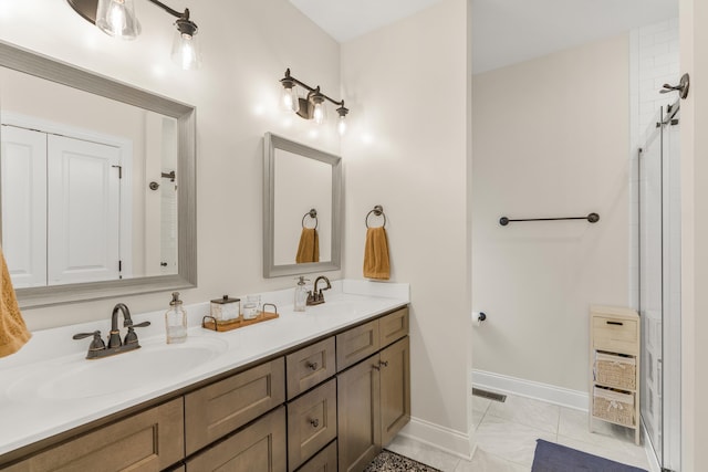 141 Tomasville Dr, Waynesboro, VA 22980 - bathroom featuring baseboards, visible vents, a sink, and double vanity