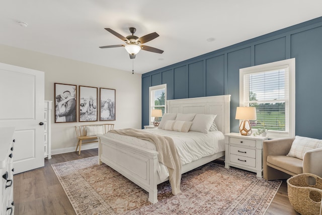 141 Tomasville Dr, Waynesboro, VA 22980 - bedroom with a decorative wall, wood finished floors, and a ceiling fan