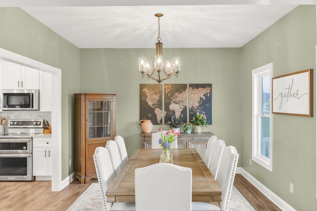 141 Tomasville Dr, Waynesboro, VA 22980 - dining area featuring baseboards, light wood finished floors, and an inviting chandelier