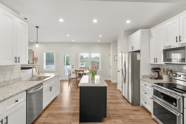 141 Tomasville Dr, Waynesboro, VA 22980 - kitchen with a sink, stainless steel appliances, tasteful backsplash, and white cabinets
