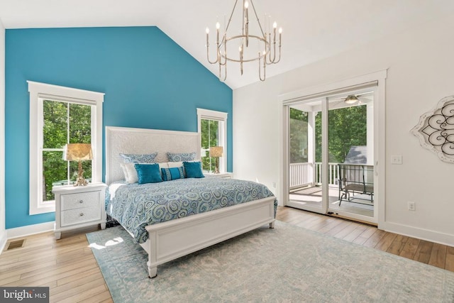 11206 Preswick Ln, Spotsylvania, VA 22551 - bedroom with access to outside, hardwood / wood-style floors, a chandelier, multiple windows, and high vaulted ceiling