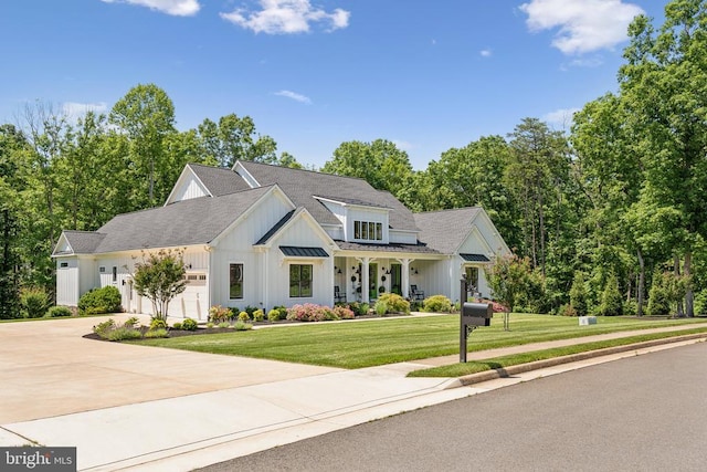 11206 Preswick Ln, Spotsylvania, VA 22551 - modern farmhouse with board and batten siding, a front lawn, concrete driveway, and an attached garage