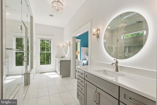 11206 Preswick Ln, Spotsylvania, VA 22551 - bathroom with a chandelier, two vanities, and a shower stall