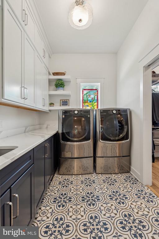 11206 Preswick Ln, Spotsylvania, VA 22551 - laundry room with cabinet space and washing machine and clothes dryer
