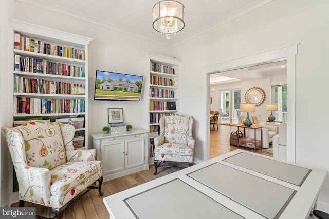11206 Preswick Ln, Spotsylvania, VA 22551 - sitting room with a chandelier, light wood-type flooring, and crown molding