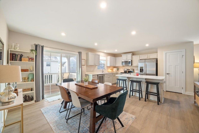 dining area with light hardwood / wood-style flooring