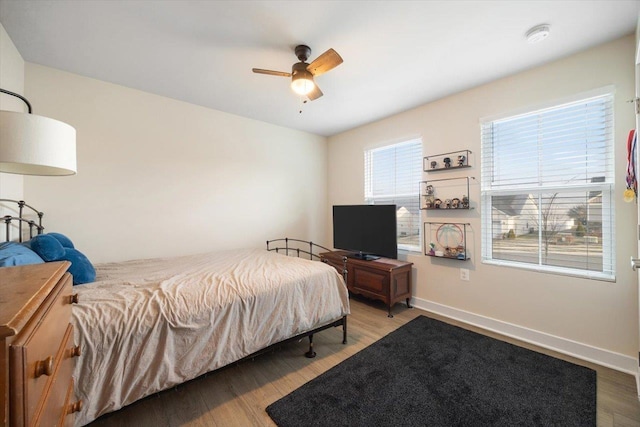 bedroom featuring hardwood / wood-style flooring and ceiling fan