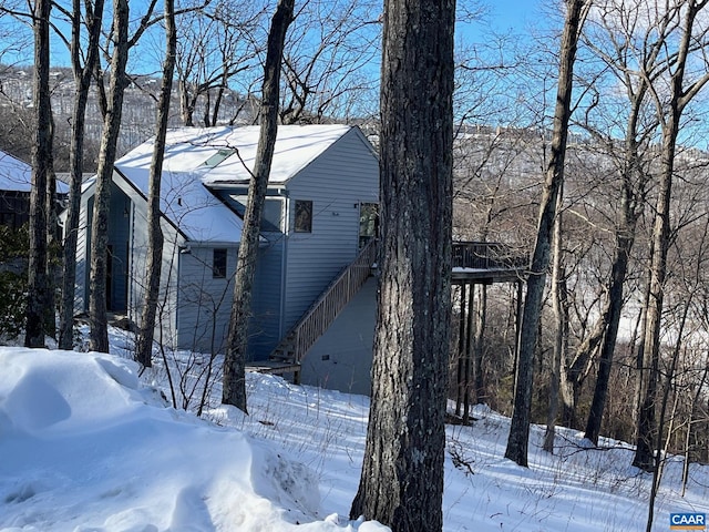 100 N Rock Tree Ln, Wintergreen Resort, VA 22967 - snow covered property featuring stairway