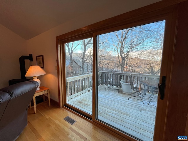100 N Rock Tree Ln, Wintergreen Resort, VA 22967 - entryway featuring light wood-style floors, lofted ceiling, and baseboards