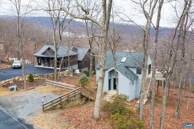 100 N Rock Tree Ln, Wintergreen Resort, VA 22967 - view of front of house featuring stairs, a mountain view, and a porch