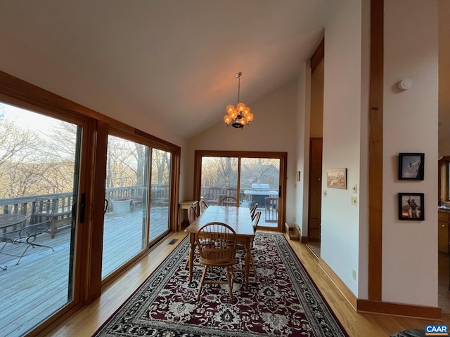 100 N Rock Tree Ln, Wintergreen Resort, VA 22967 - dining area featuring light wood-style floors, a chandelier, and high vaulted ceiling
