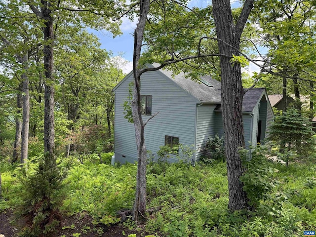 100 N Rock Tree Ln, Wintergreen Resort, VA 22967 - view of home's exterior featuring a shingled roof and crawl space