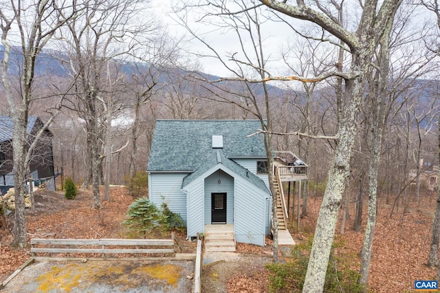 100 N Rock Tree Ln, Wintergreen Resort, VA 22967 - view of front of house featuring roof with shingles, stairway, and a wooden deck