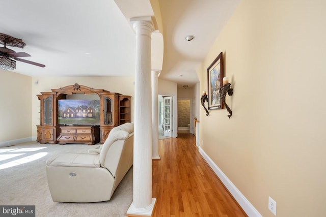 8800 General Griffins Ct, Fredericksburg, VA 22407 - hallway with decorative columns, baseboards, and light wood-style flooring