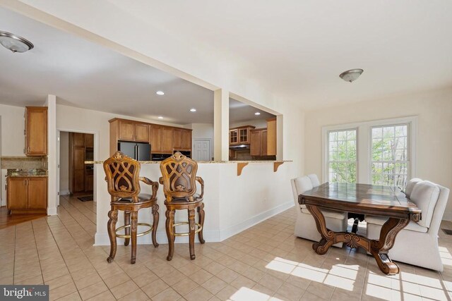 8800 General Griffins Ct, Fredericksburg, VA 22407 - dining room with recessed lighting, baseboards, and light tile patterned floors