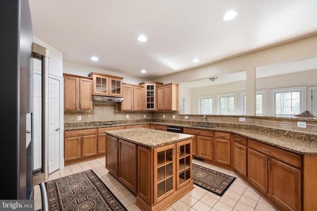 8800 General Griffins Ct, Fredericksburg, VA 22407 - kitchen featuring a sink, under cabinet range hood, light tile patterned flooring, a peninsula, and recessed lighting