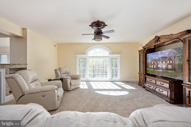 8800 General Griffins Ct, Fredericksburg, VA 22407 - carpeted living area featuring healthy amount of natural light, ceiling fan, a fireplace, and baseboards