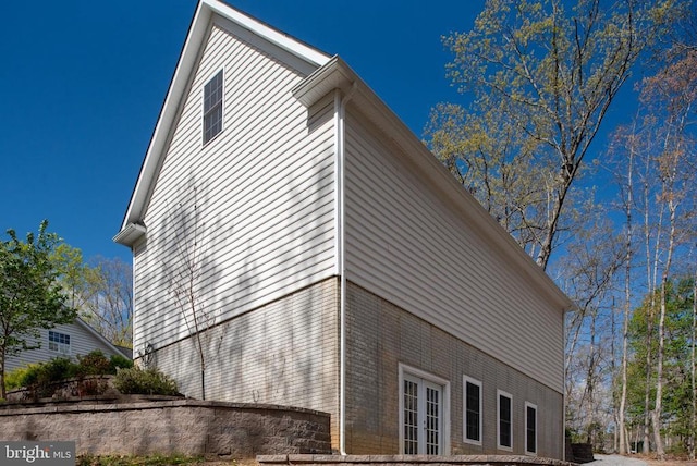 8800 General Griffins Ct, Fredericksburg, VA 22407 - view of home's exterior featuring french doors and brick siding