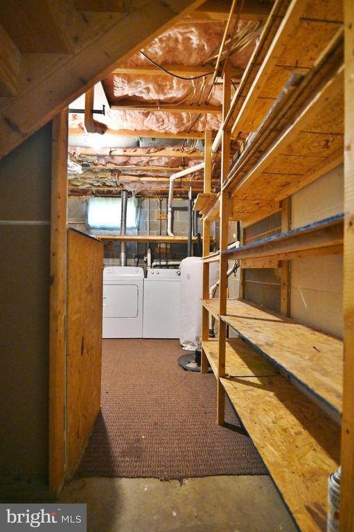 140 Wayland Dr, Stanley, VA 22851 - unfinished below grade area featuring independent washer and dryer