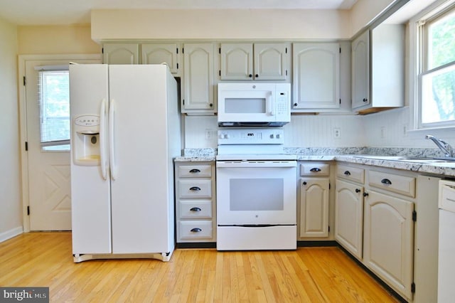 140 Wayland Dr, Stanley, VA 22851 - kitchen with white appliances, light wood-style flooring, and light stone countertops