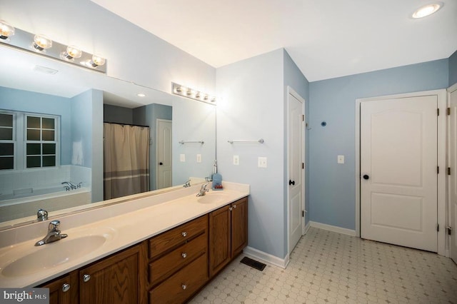 625 Yorktown Blvd, Locust Grove, VA 22508 - bathroom featuring double vanity, baseboards, tile patterned floors, and a garden tub