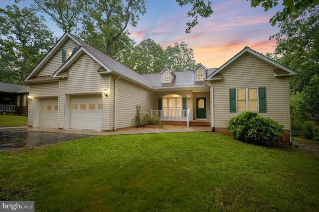 625 Yorktown Blvd, Locust Grove, VA 22508 - view of front of property featuring a porch, driveway, a garage, a front lawn, and roof with shingles