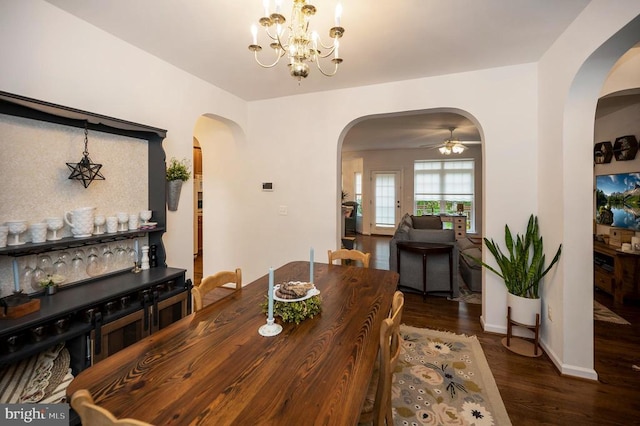 625 Yorktown Blvd, Locust Grove, VA 22508 - dining space featuring arched walkways, wood finished floors, a ceiling fan, a chandelier, and baseboards