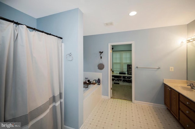 625 Yorktown Blvd, Locust Grove, VA 22508 - bathroom with a garden tub, vanity, tile patterned floors, baseboards, and curtained shower