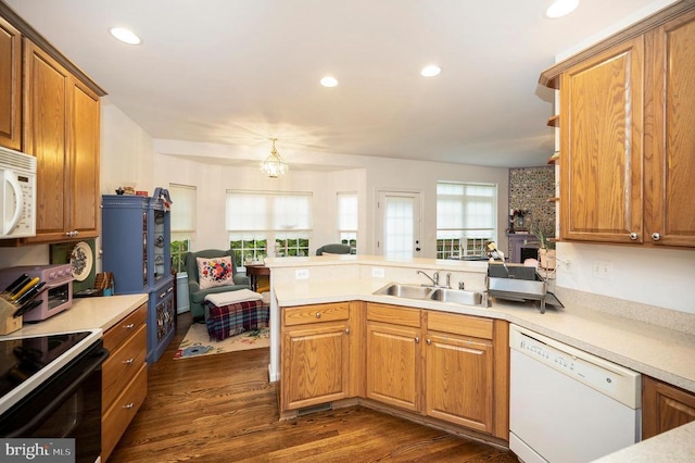 625 Yorktown Blvd, Locust Grove, VA 22508 - kitchen with white appliances, a sink, a peninsula, dark wood-type flooring, and light countertops