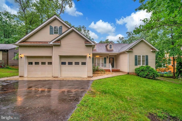 625 Yorktown Blvd, Locust Grove, VA 22508 - view of front of home with asphalt driveway, covered porch, a front yard, and roof with shingles