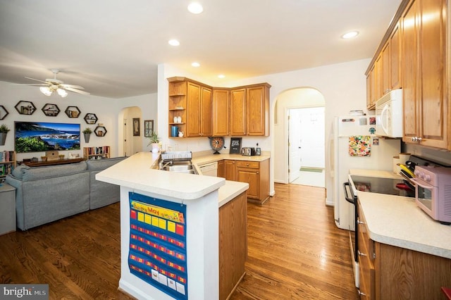 625 Yorktown Blvd, Locust Grove, VA 22508 - kitchen featuring arched walkways, white microwave, stainless steel range oven, open floor plan, and a peninsula