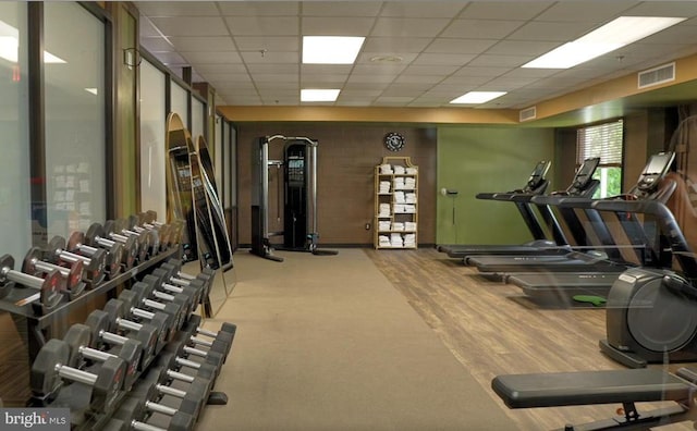 workout area with a drop ceiling