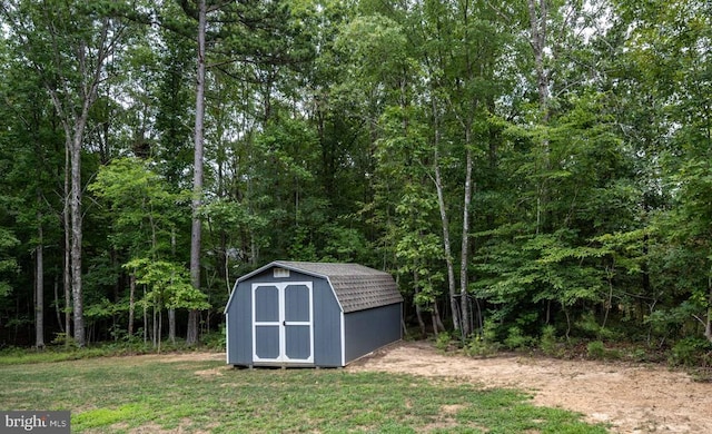 view of outdoor structure with a lawn