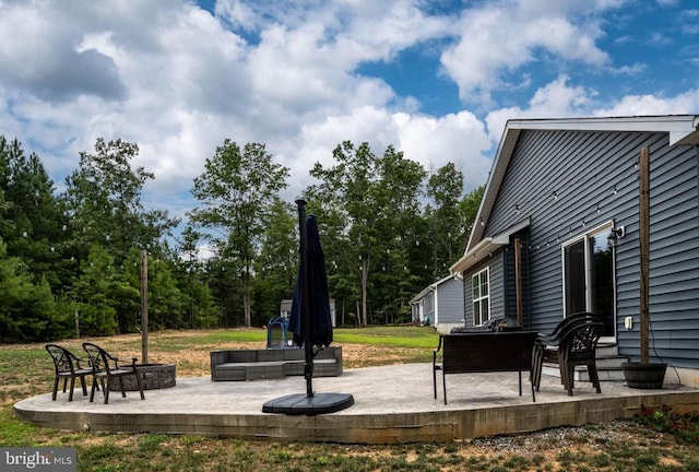 view of yard with an outdoor living space and a patio area