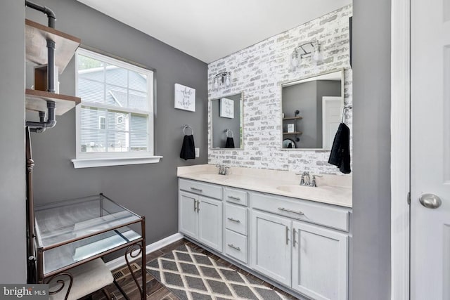 bathroom with tasteful backsplash and vanity