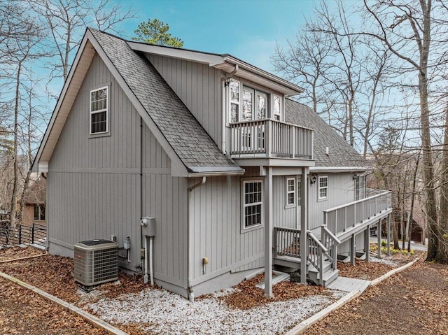 130 Rainier Rd, Mcgaheysville, VA 22840 - view of front facade featuring a balcony, central air condition unit, and a shingled roof