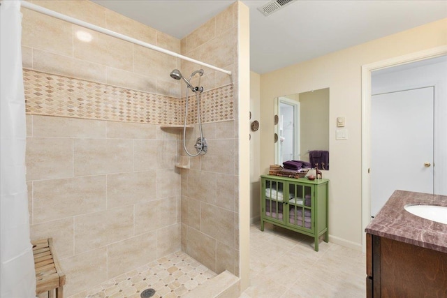 130 Rainier Rd, Mcgaheysville, VA 22840 - full bathroom featuring a tile shower, vanity, baseboards, and tile patterned flooring