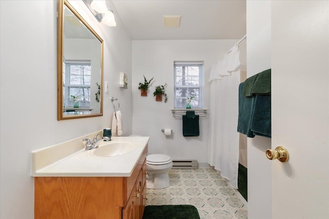 130 Rainier Rd, Mcgaheysville, VA 22840 - bathroom with a baseboard heating unit, vanity, toilet, and a shower with shower curtain