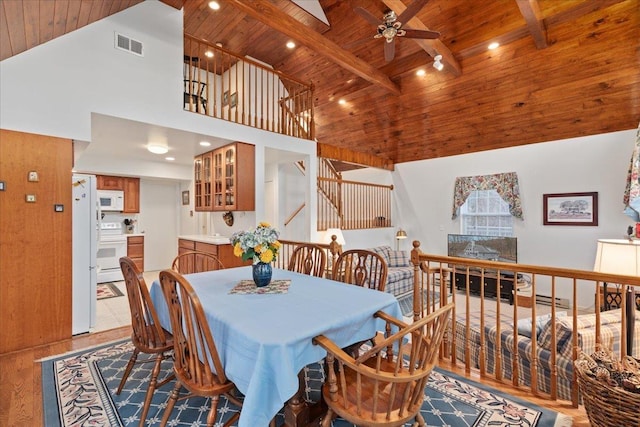 130 Rainier Rd, Mcgaheysville, VA 22840 - dining area with wooden ceiling with exposed beams, ceiling fan, high vaulted ceiling, light wood finished floors, and stairway