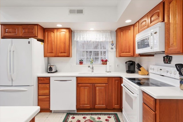 130 Rainier Rd, Mcgaheysville, VA 22840 - kitchen with white appliances, a sink, brown cabinets, recessed lighting, and light countertops