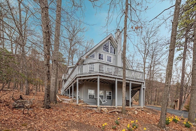130 Rainier Rd, Mcgaheysville, VA 22840 - rear view of property featuring a deck, stairway, asphalt driveway, and board and batten siding